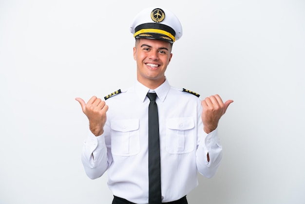 Airplane pilot caucasian man isolated on white background with thumbs up gesture and smiling