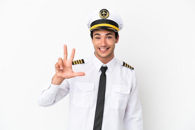 Airplane pilot over isolated white background happy and counting three with fingers