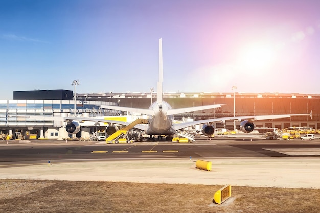 Airplane on runway against sky