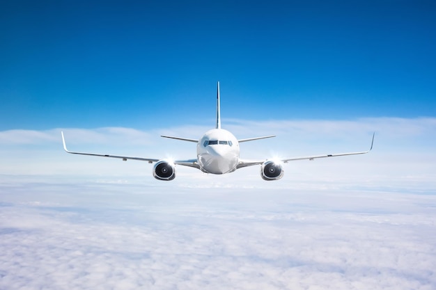 Airplane in the sky above the cloudscape flight journey trip view straight