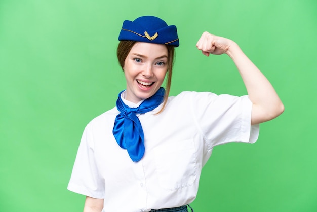 Airplane stewardess over isolated chroma key background doing strong gesture