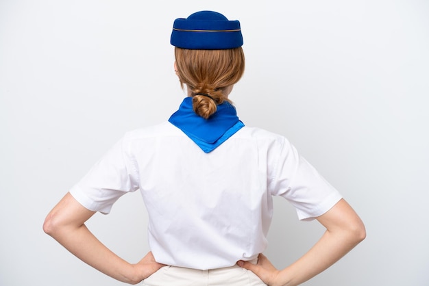 Airplane stewardess woman isolated on white background in back position