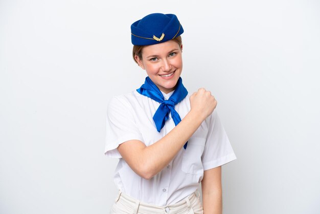 Airplane stewardess woman isolated on white background celebrating a victory