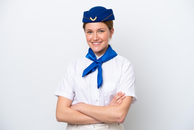 Airplane stewardess woman isolated on white background keeping the arms crossed in frontal position