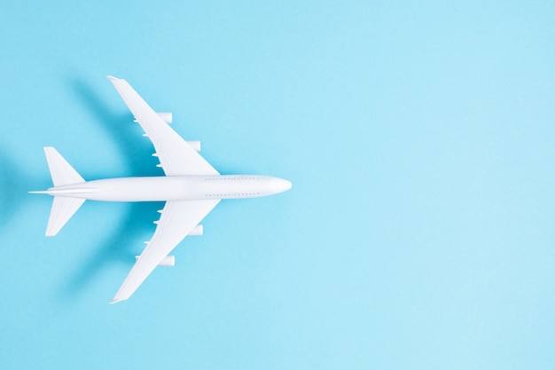 Airplane toy on blue background