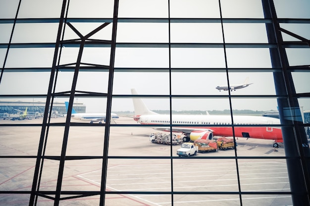 Airport window scene an arriving flight