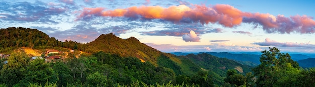 Akha village in the mountains of North Laos sunset dramatic sky