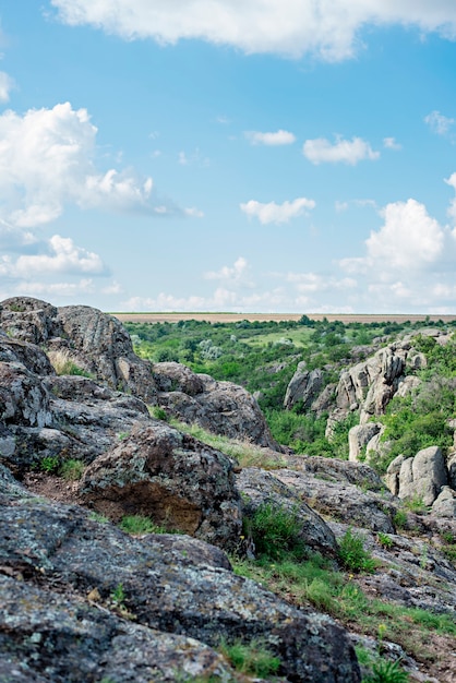 Aktovsky canyon in Ukraine a tourist place Cluster of stones panoramic views of green slopes