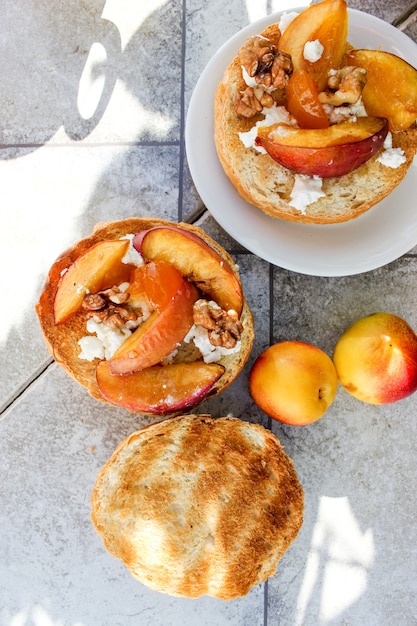 Al fresco Breakfast of grilled bread rolls with goat fat, fruit, nuts, orange juice and coffee