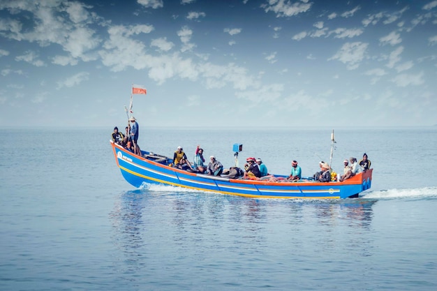 Alappuzha India Fishermen sail in a boat on sea fishing