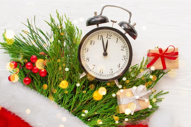 Alarm clock and Christmas decorations. Christmas, new year concept, winter