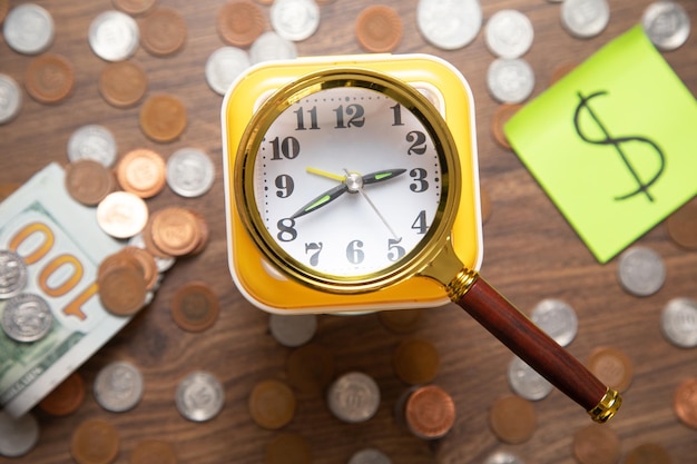 Alarm clock and coins Business