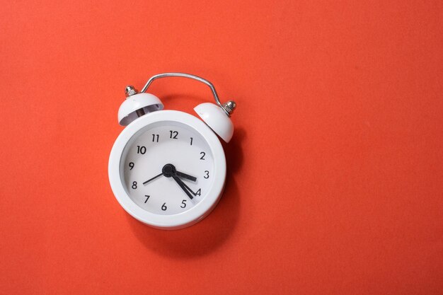 Alarm clock on colorful background