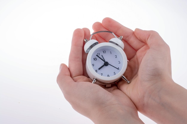 Alarm clock in hand