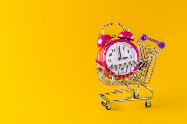 Alarm clock and mini trolley cart with space copy