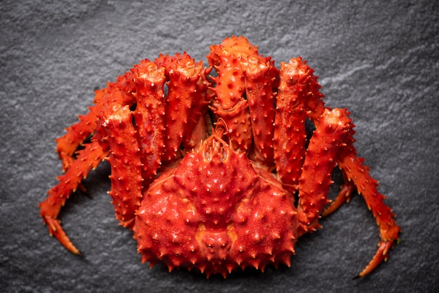 Alaskan King Crab Cooked steam or Boiled seafood on dark / Red crab hokkaido