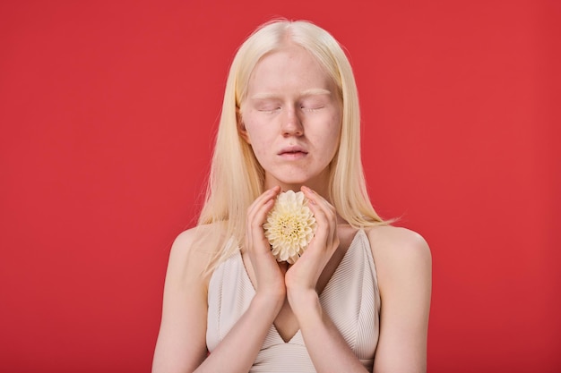 Albino girl with natural beauty with flower