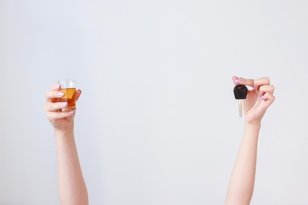 Alcohol and car keys selection on a white background