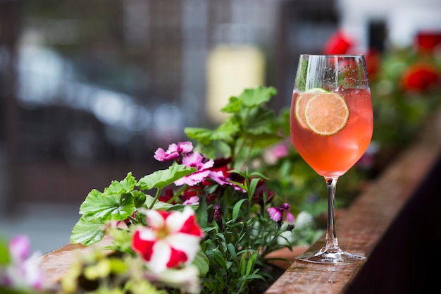 Alcohol cocktail on a wooden barrel