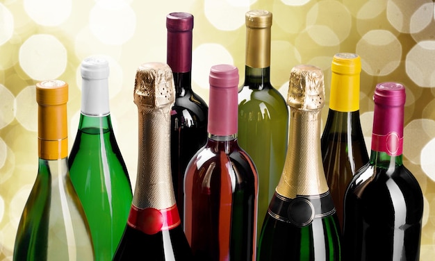 Alcohol drinks bottles on light background