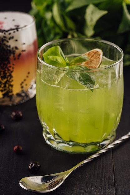 Alcoholic cocktail basil smash with green basil