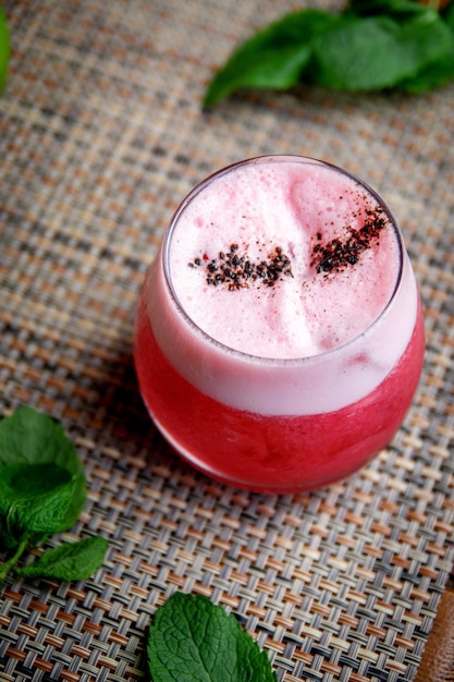 Alcoholic cocktail clover club drink with gin raspberries and egg white foam