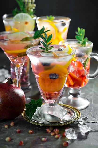 Alcoholic cocktail with fruit and ice