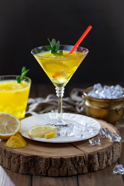 Alcoholic cocktail with fruit and ice