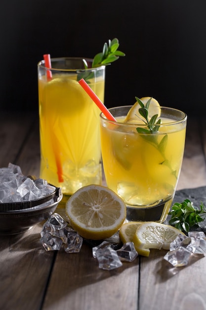 Alcoholic cocktail with fruit and ice