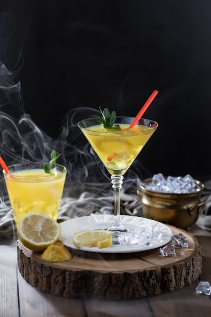 Alcoholic cocktail with fruit and ice