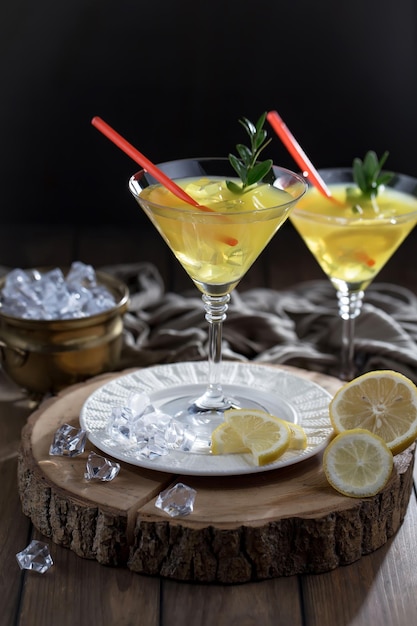 Alcoholic cocktail with fruit and ice