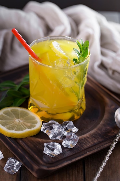 Alcoholic cocktail with fruit and ice