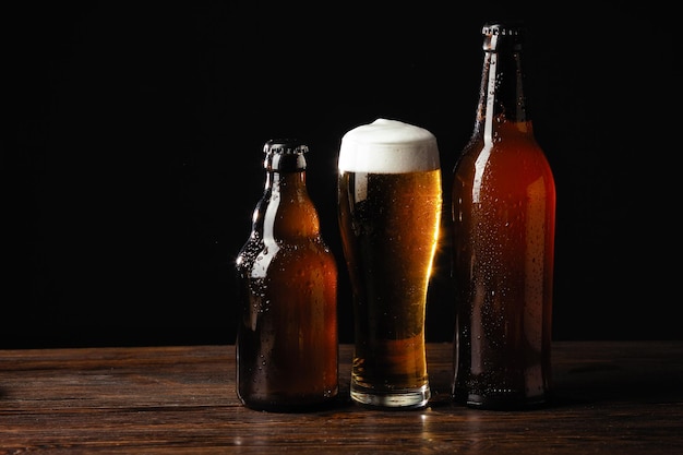 Alcoholic drinks beer with foam isolated on black background