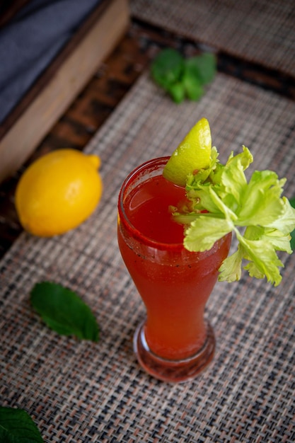 Alcoholic refreshing cocktail bloody mary with celery Virgin mary cocktail served in a cup with celery sticks