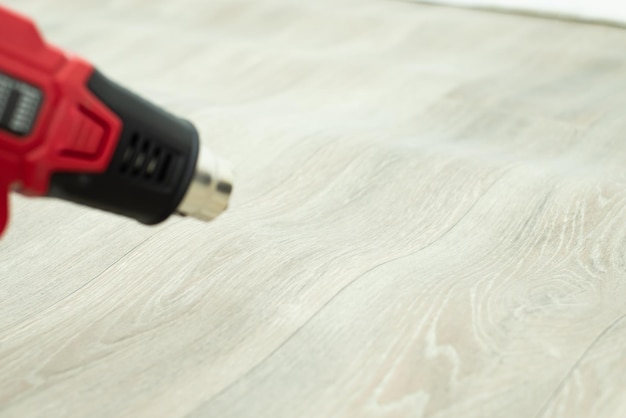 Aligning waves on linoleum covering with building air dryer