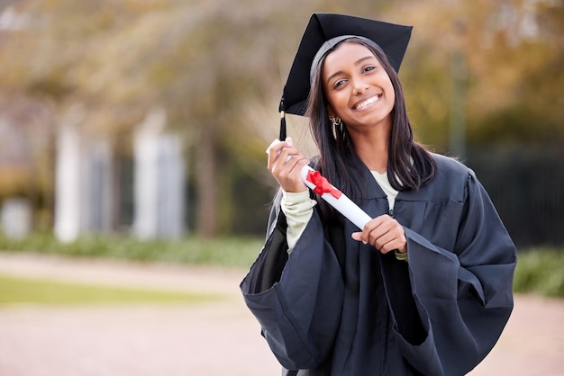 All my efforts measured up to this. Portrait of a young woman holding her diploma on graduation day.