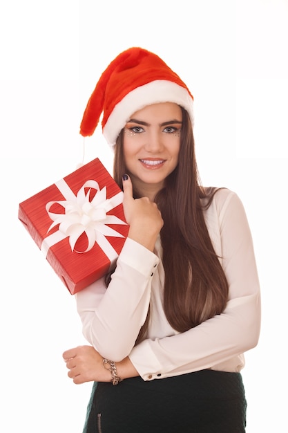 Alluring christmas girl with red gift box in hand