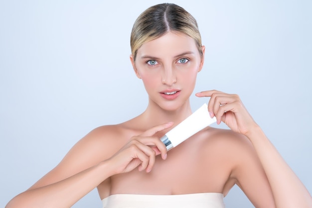 Alluring portrait of perfect skin woman holding mockup moisturizer tube