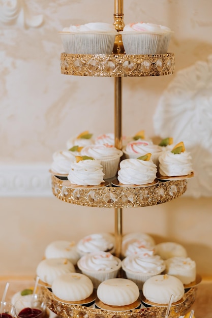 Almond cookies sweet cakes for a wedding banquet A delicious reception a luxurious ceremony Table with sweets and desserts Delicious colorful French desserts on a plate or table Candy bar