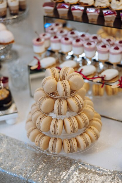 Almond cookies sweet cakes for a wedding banquet A delicious reception a luxurious ceremony Table with sweets and desserts Delicious colorful French desserts on a plate or table Candy bar