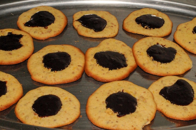 Almond cookies with a jam bath