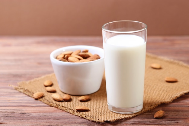 Almond milk and almonds on the table vegetable milk vegetarian milk