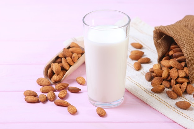 Almond milk and almonds on the table vegetable milk vegetarian milk