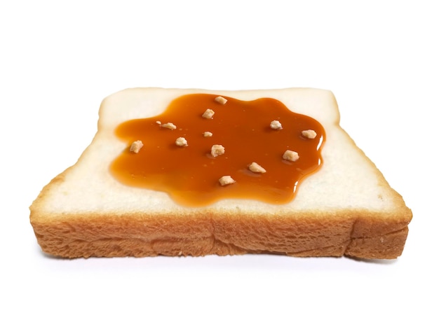 Almond Nuts and caramel sauce nuts on sliced bread on white background