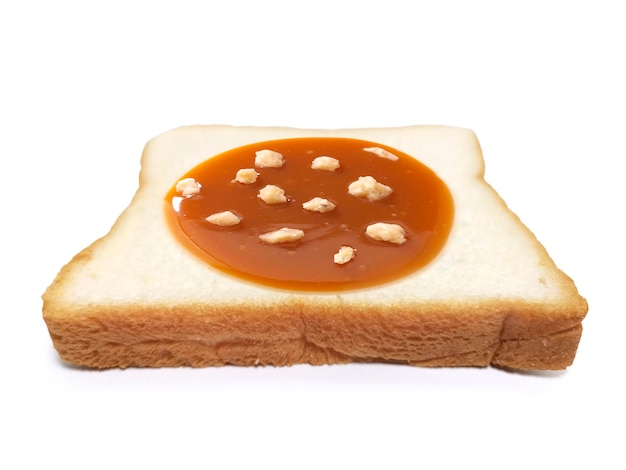 Almond Nuts and caramel sauce nuts on sliced bread on white background