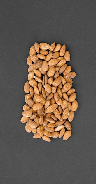 Almond nuts isolated on black background