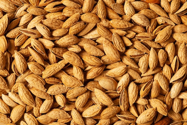 Almond nuts with shell texture and background top view