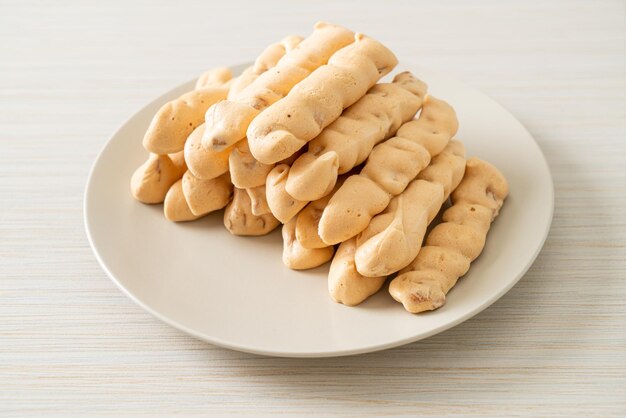 Almonds meringue stick on plate French snack dessert style