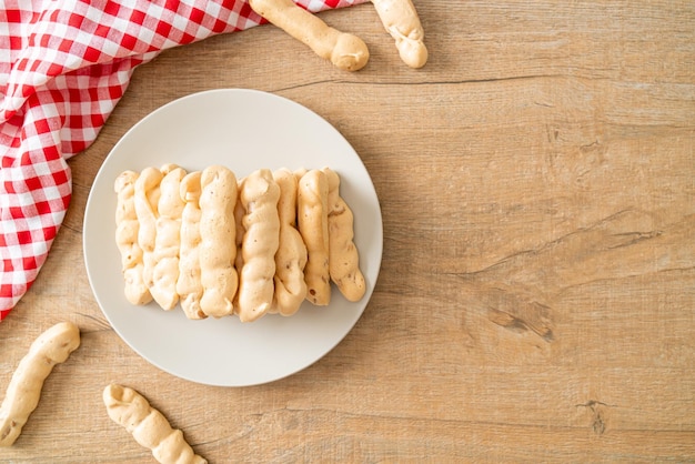 Almonds meringue stick on plate French snack dessert style