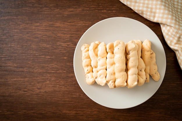 Almonds meringue stick on plate